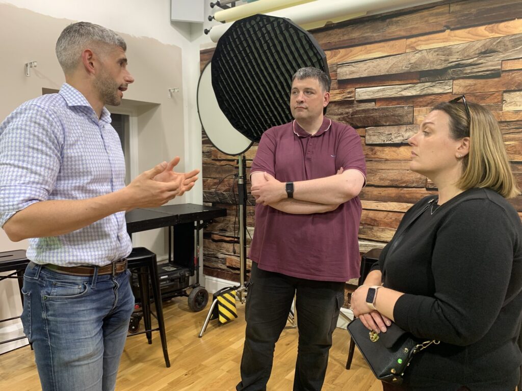 Guests networking in the studio after the launch panel