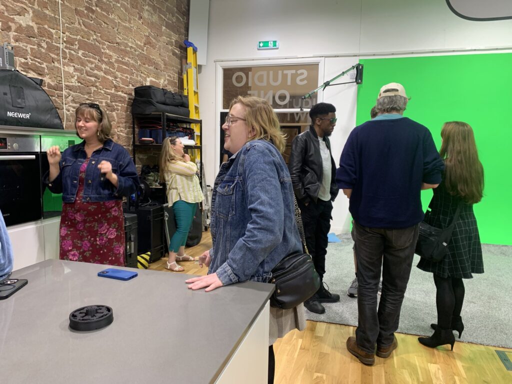 Guests touring the green screen infinity cove in Studio One
